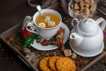 Tea hot drink on old background in composition on the table
