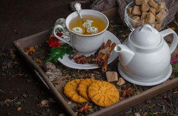 Tea hot drink on old background in composition on the table