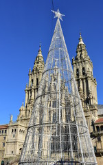 Cathedral from Praza do Obradoiro with Christmas led tree and blue sky. Santiago de Compostela, Spain.