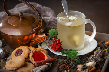 Tea hot drink on old background in composition on the table