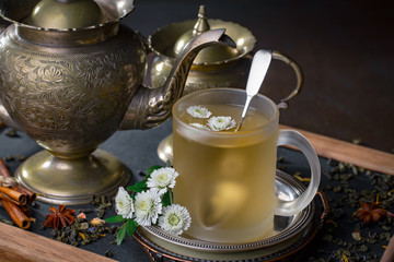 Tea hot drink on old background in composition on the table