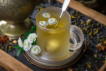 Tea hot drink on old background in composition on the table