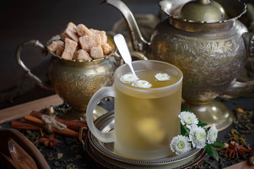 Tea hot drink on old background in composition on the table