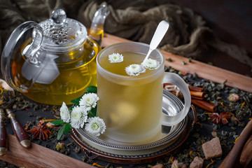 Tea hot drink on old background in composition on the table