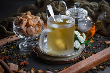 Tea hot drink on old background in composition on the table