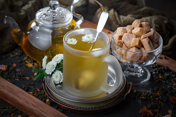 Tea hot drink on old background in composition on the table