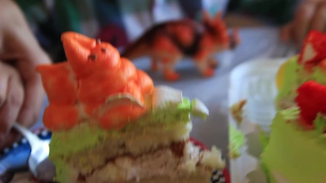 Taking out a piece of cake. A piece of Thoth. Birthday. Holiday. Happiness. Holiday cake. Candles on the cake. Close-up.