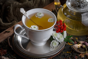 Tea hot drink on old background in composition on the table