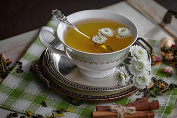 Tea hot drink on old background in composition on the table