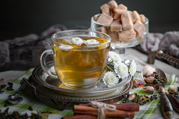 Tea hot drink on old background in composition on the table