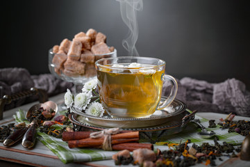 Tea hot drink on old background in composition on the table