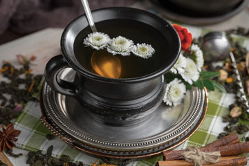 Tea hot drink on old background in composition on the table