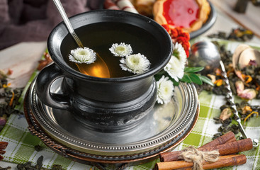 Tea in a cup on an old background