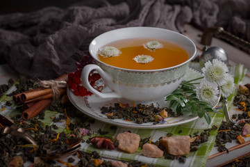Tea hot drink on old background in composition on the table