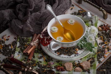 Tea hot drink on old background in composition on the table