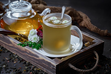 Tea hot drink on old background in composition on the table
