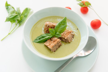 Pea cream soup on the dinner table
