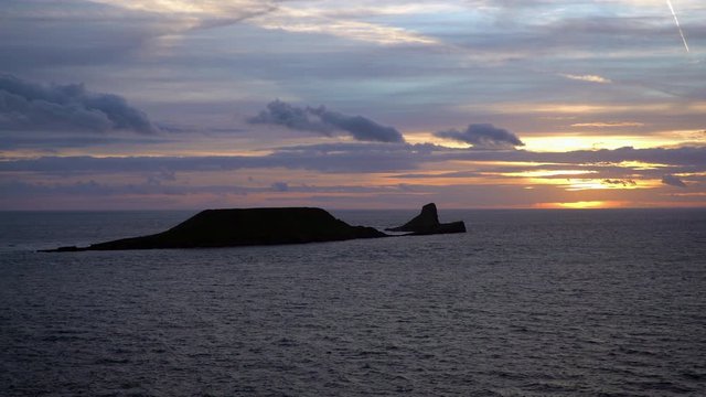 United Kingdom, South Wales, Gower peninsular, sunset over Worms Head