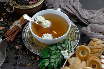 Tea in a cup on an old background