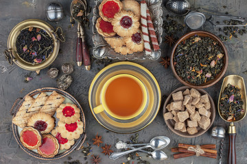 Tea hot drink on old background in composition on the table