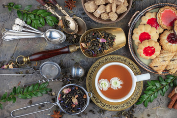 Tea hot drink on old background in composition on the table