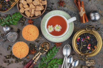 Tea hot drink on old background in composition on the table