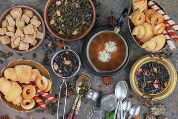 Tea hot drink on old background in composition on the table