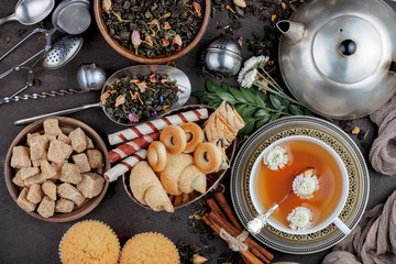 Tea hot drink on old background in composition on the table
