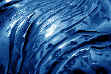 Metal rough surface with blur effect in navy blue tone.
