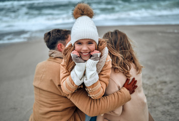Family on the beach near the sea