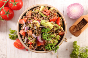 lentils salad with avocado, tomato, onion and sauce