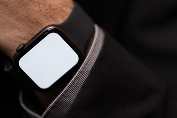 Close up of Businessman's hand looking at hand watch