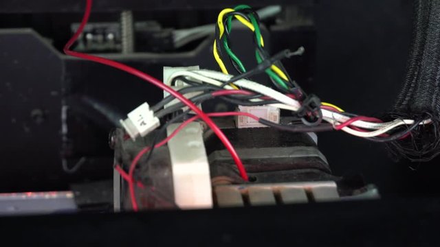 3D printer head in operation. 3D diy printer printing plastic mechanical parts .An open source diy 3d printer is printing gears and pulleys, using disposable biodegreadable PLA material (filament). 4k