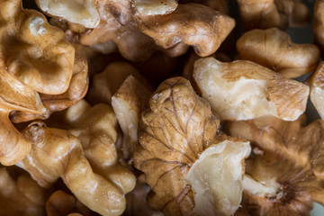 Many brown walnuts close up still