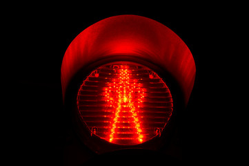 Red traffic light sign close up. Adjustment of vehicles with LED lamps.