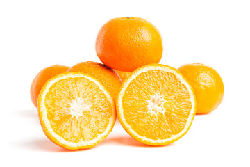 Sliced round halves of orange fruit and whole citrus isolated on white background