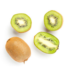 Sliced halves and whole kiwi fruit isolated on white background, top view, flat lay
