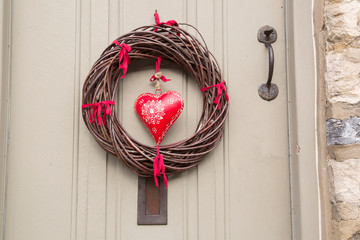 Red Heart Christmas Wreath on Wooden Front Door
