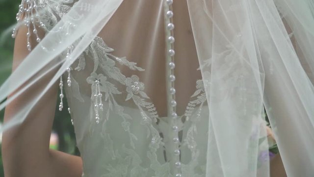 details of the bride in the wedding dress