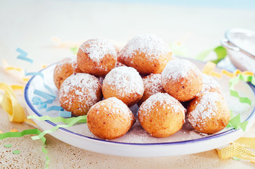 Castagnoli- italian fritters in carnival on white plate.