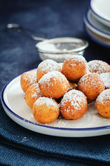 Castagnoli- italian fritters in carnival on white plate.