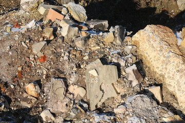 Construction waste with elements of various dismantled and destroyed old structures at municipal...