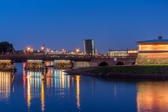 the span of the Trinity bridge, raised up, rises above other historical buildings of the city