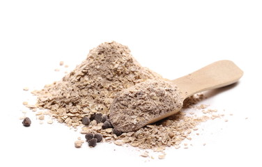 Oat flakes and power, instant oats with chocolate and quinoa seeds with wooden spoon isolated on...