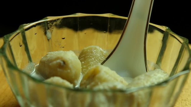 Bananas in coconut milk or Kluy Baud-she , Thai famous dessert