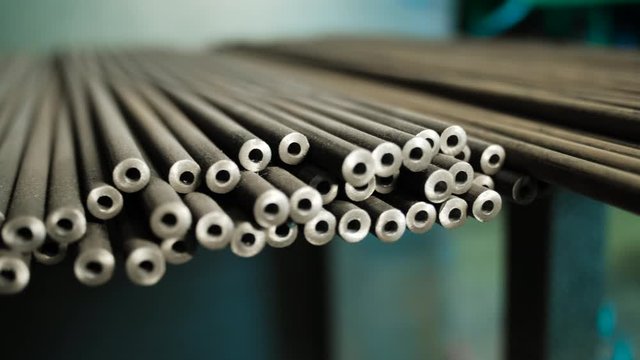 Close-up of metal pipe. Metal profile pipe at the warehouse of metal products.