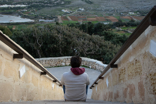 man sitting on stairs