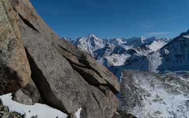 rocky mountains in december under blue sky