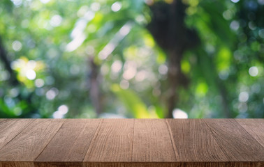 Empty dark wooden table in front of abstract blurred bokeh background of restaurant . can be used for display or montage your products.Mock up for space.