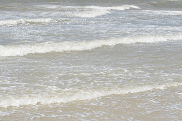 Fototapeta na wymiar waves on the beach on the north sea on a island in germany